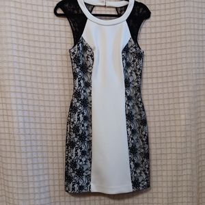 Guess size 4 dress. White with black lace detailing.  Gold zip back with 2 gold